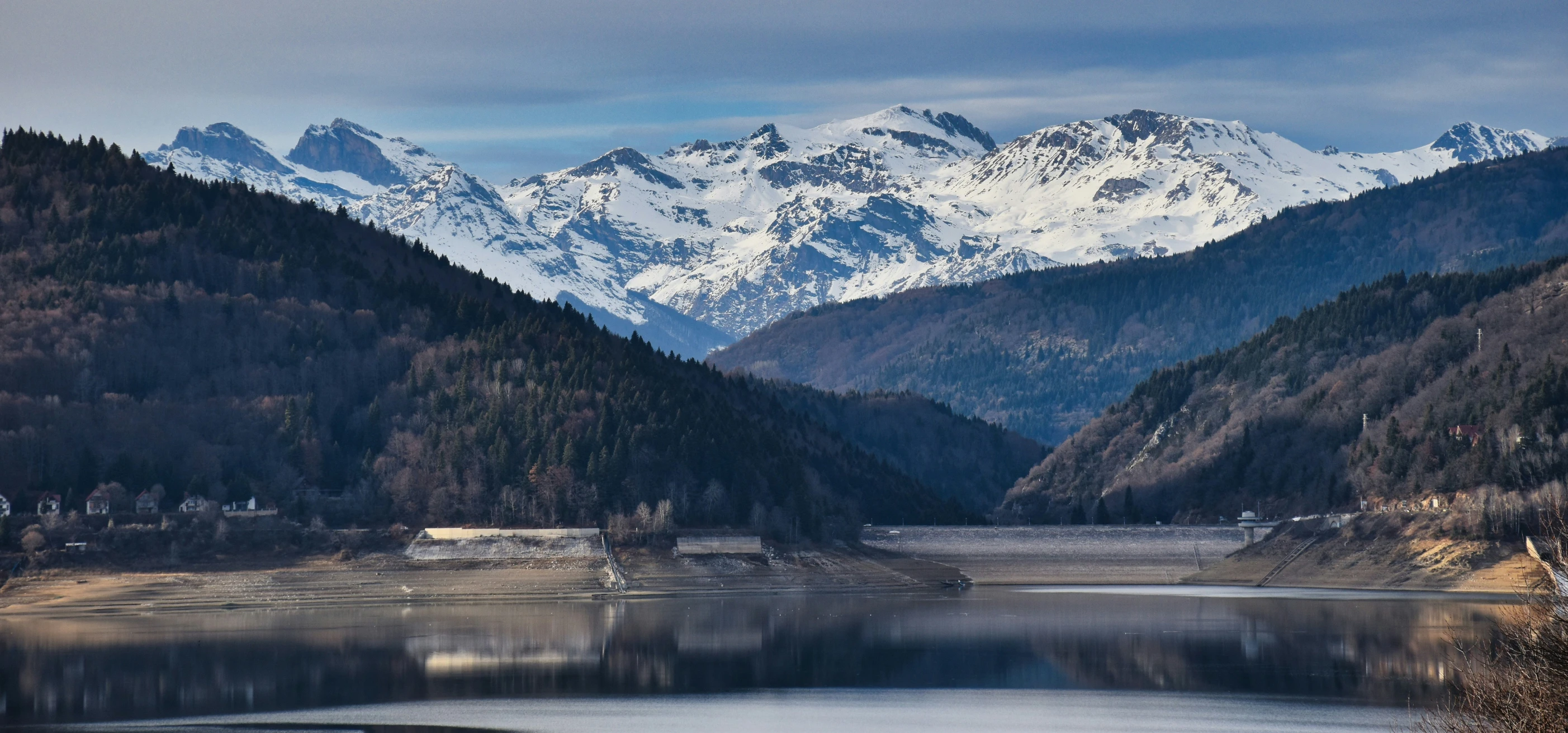 a mountain is shown with a lake in the foreground