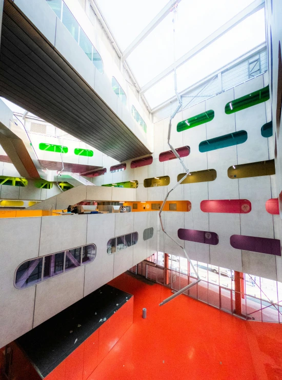 an architecture building that has a large red floor