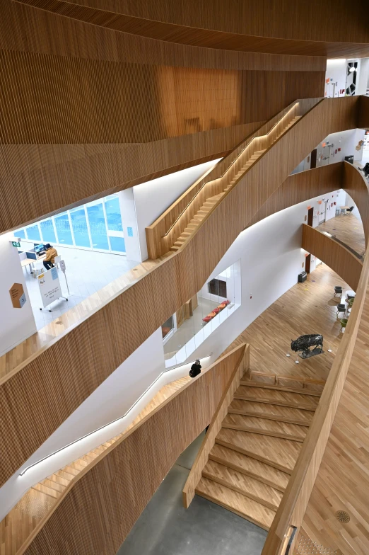 a wooden staircase inside a building with lots of wood
