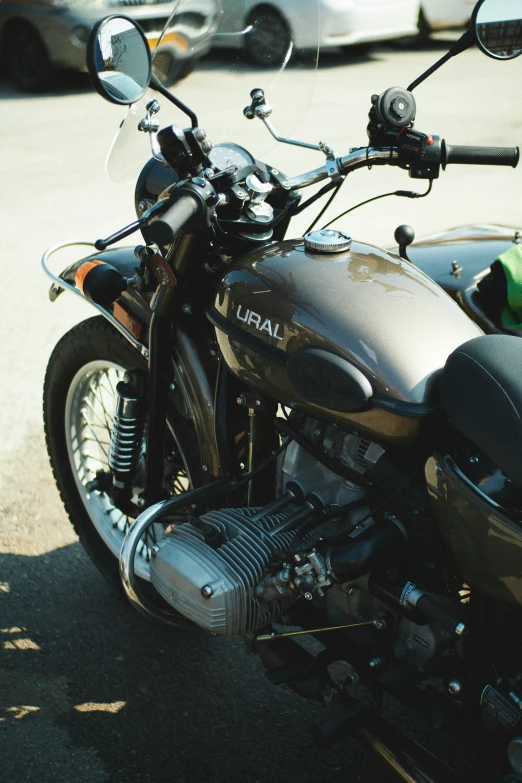 a parked motorcycle is seen with the headlights on