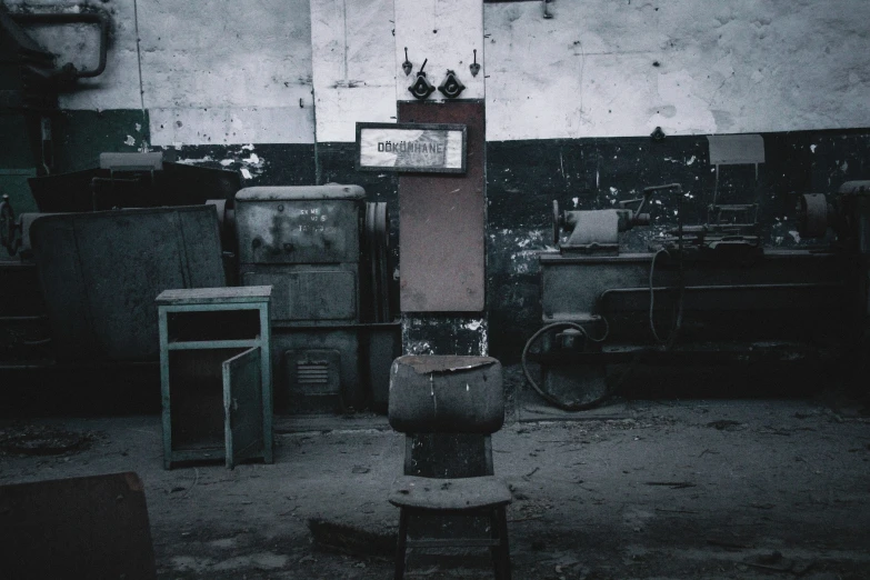 an old room with furniture and boxes, the floor is dirty