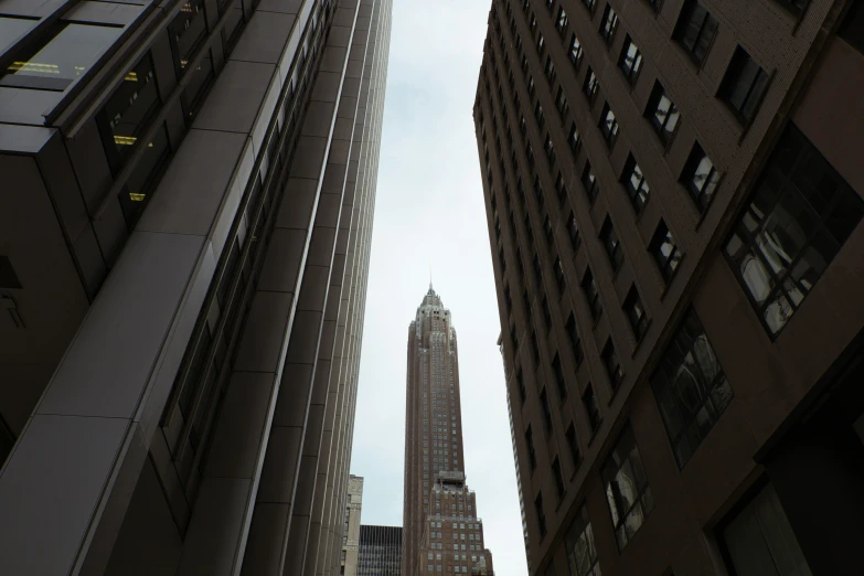 a large tall building towering over a city