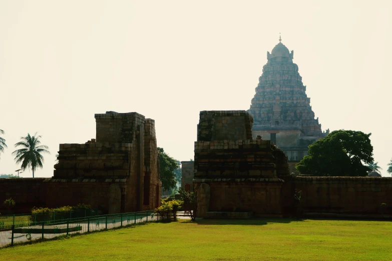 a large building on a very green field