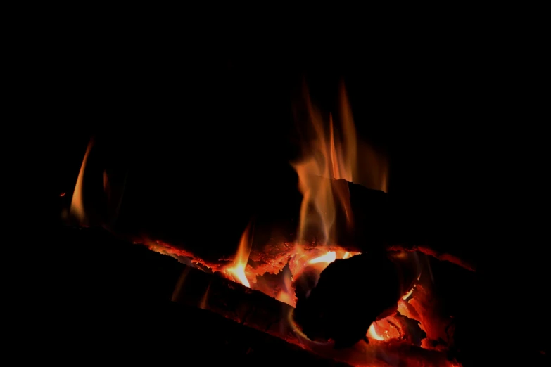 closeup of fire in the dark in front of the camera