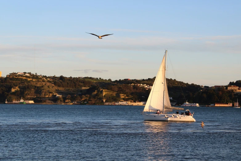 there is a sailboat sailing in the water