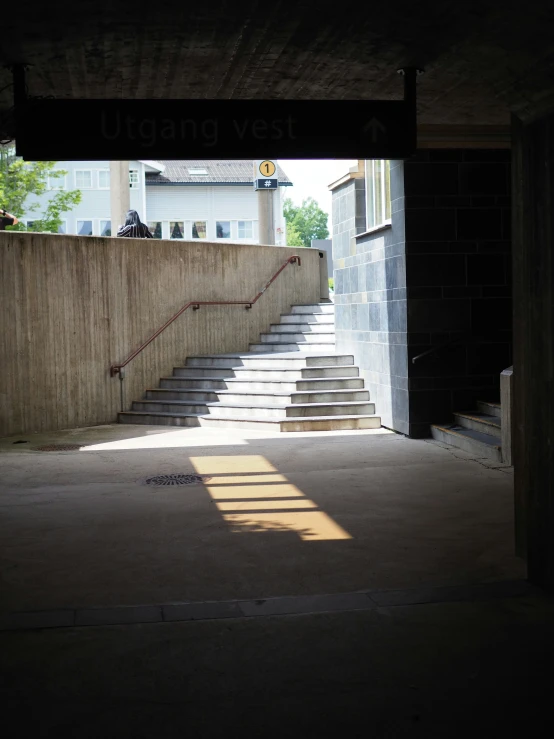 staircases are running down the walls of a concrete area