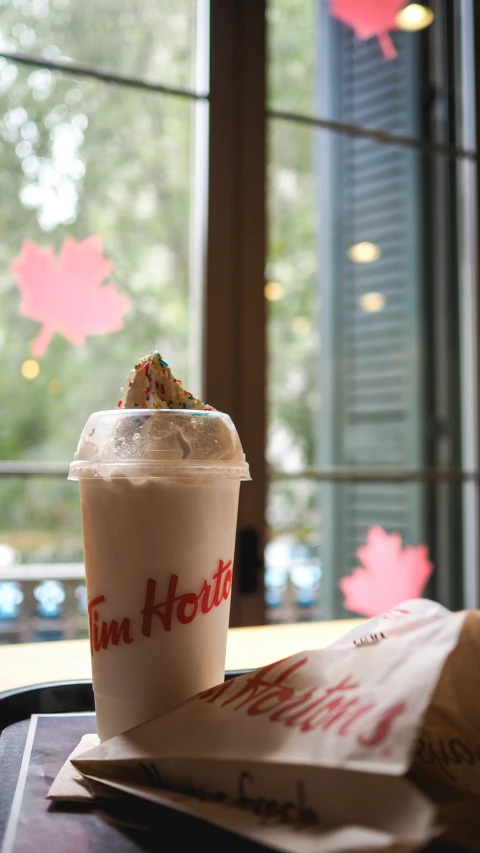 a krispy kreme drink sits on a table