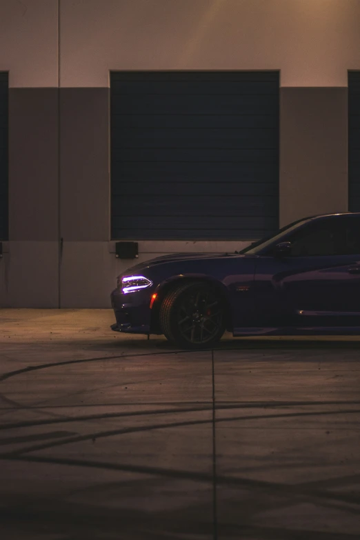 an extremely dark car parked on the street