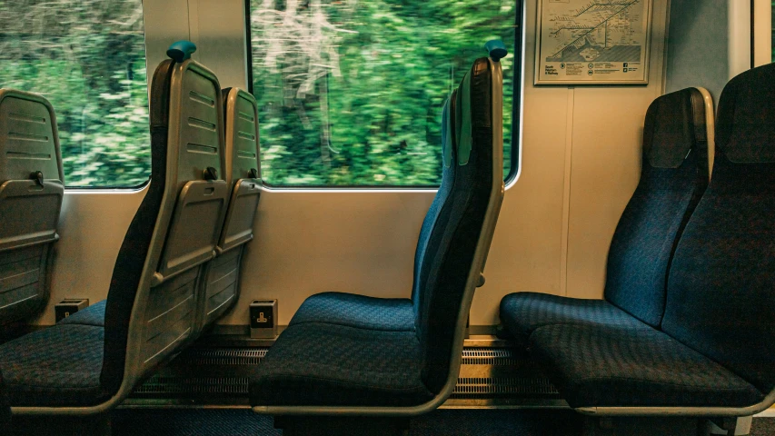 the seats in this train are facing away from each other