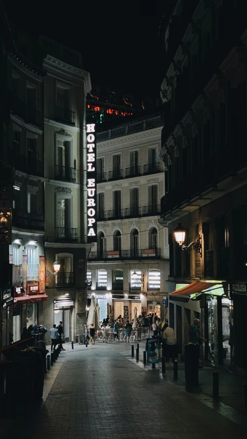 a view of the lights on an illuminated sign and buildings