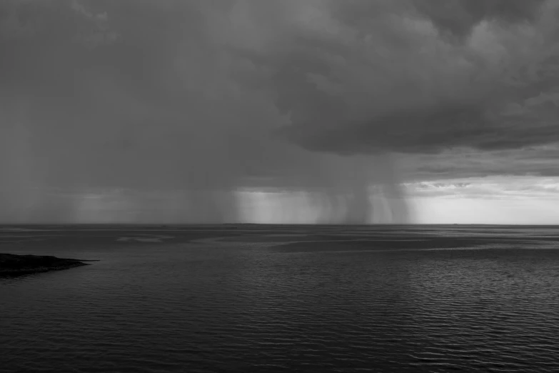 a large storm rolls over a large body of water