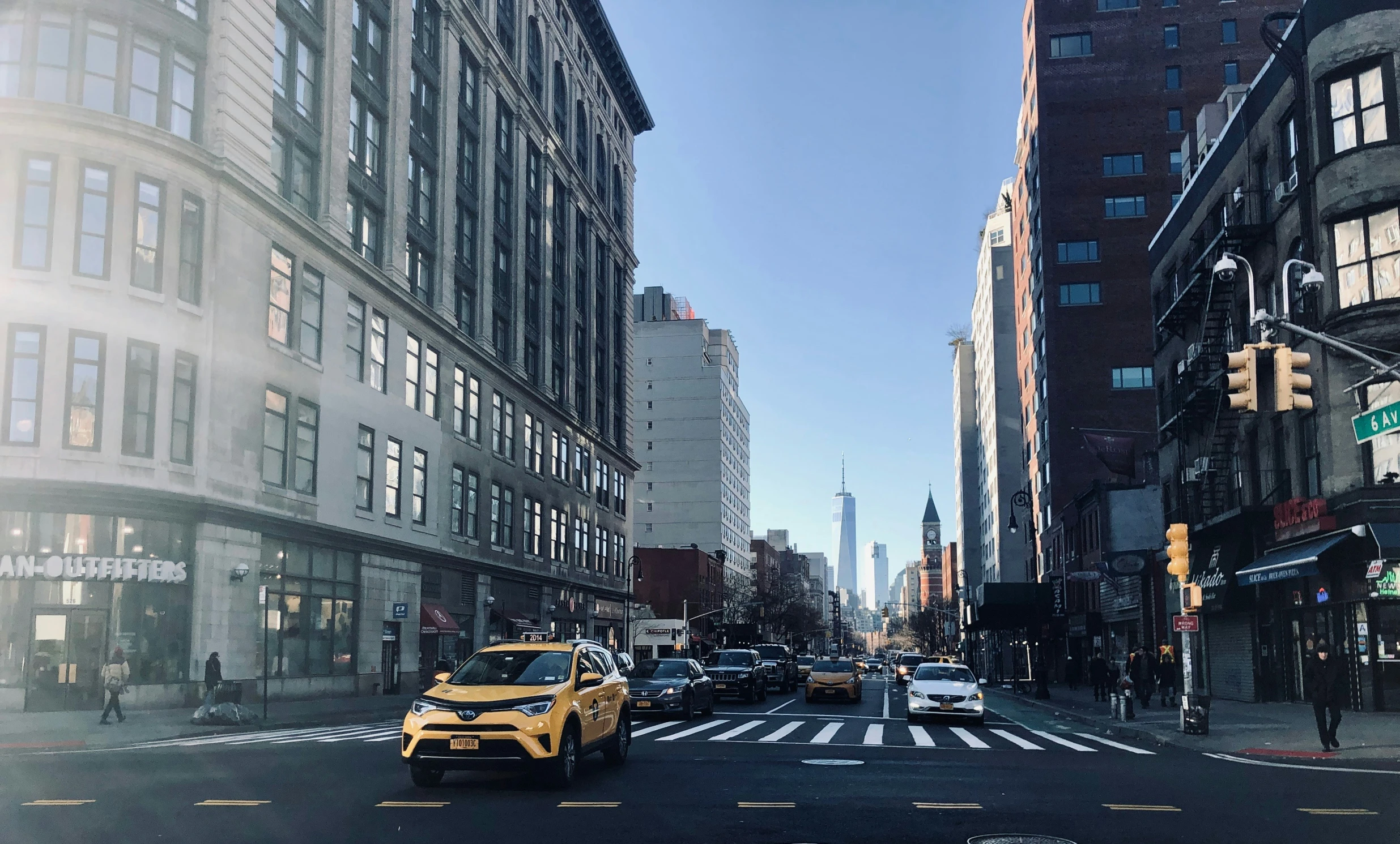 several cars are driving in the streets of new york