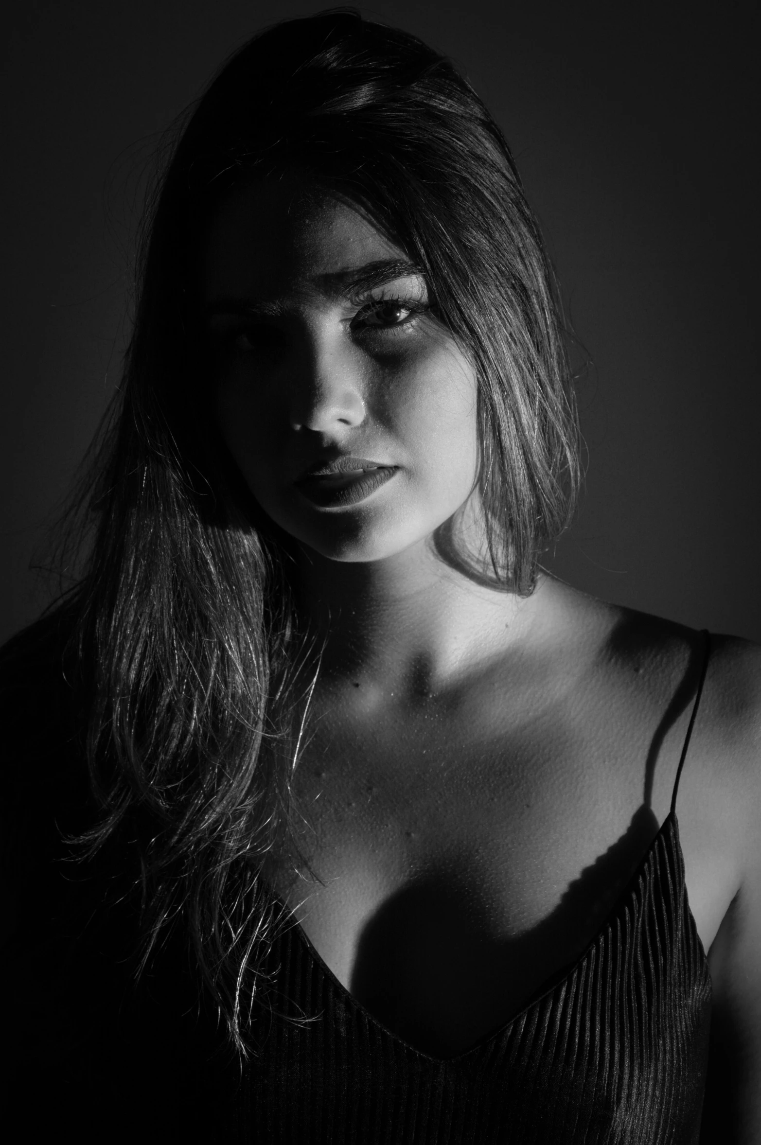 woman in dark black and white pose for a portrait