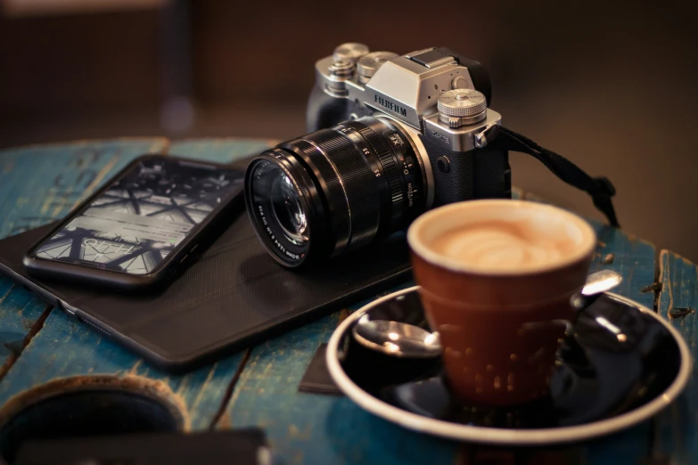 a camera sitting on top of a wooden table