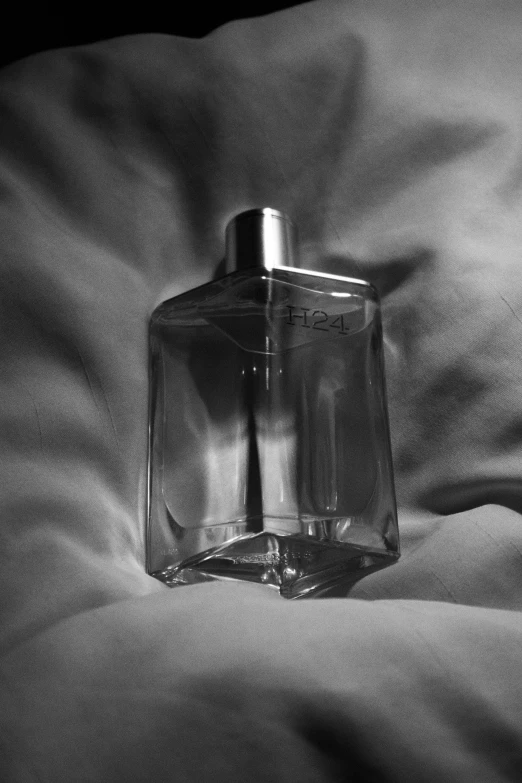 the bottle has been placed on a bed