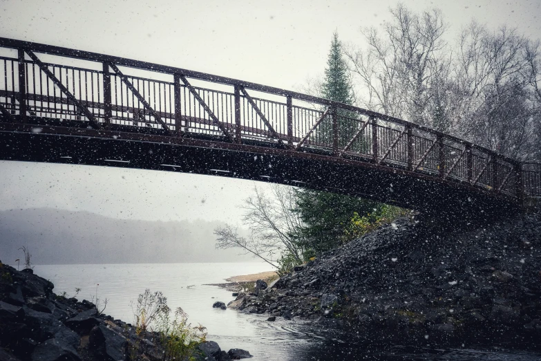 a train crossing a bridge that is over a river