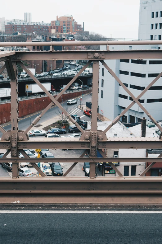 the traffic is driving on an overpass in a city