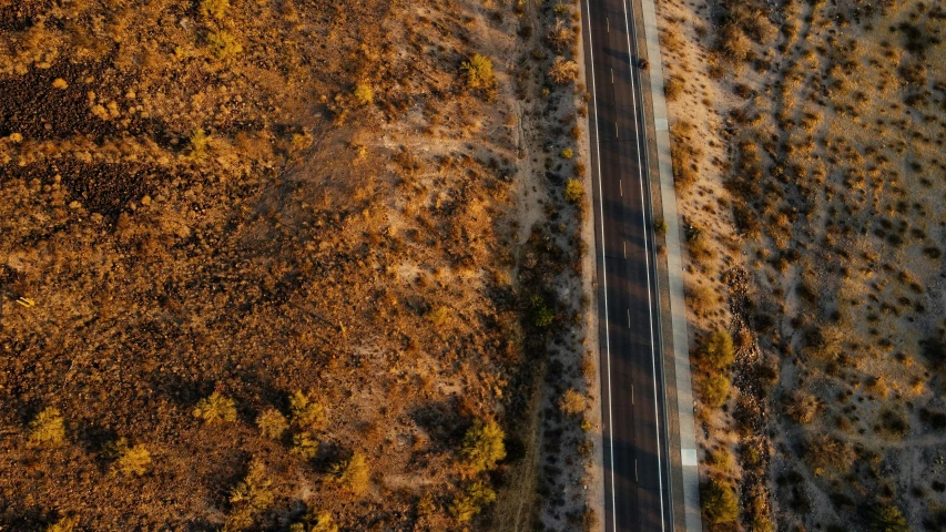 an aerial po of a freeway in the middle of autumn