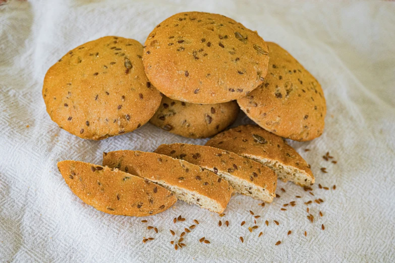 several cookies and pieces of them on a towel