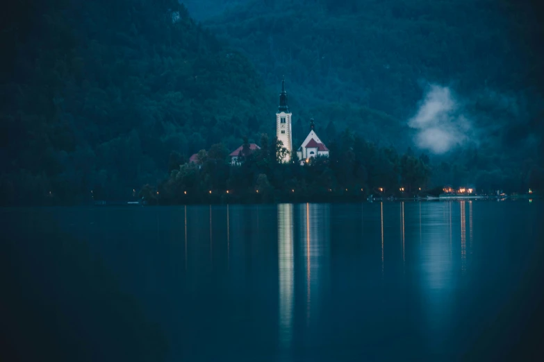 a tall church that is next to some trees