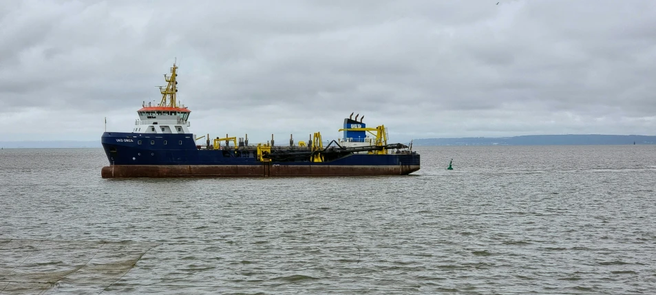 large ship floating in the middle of the ocean