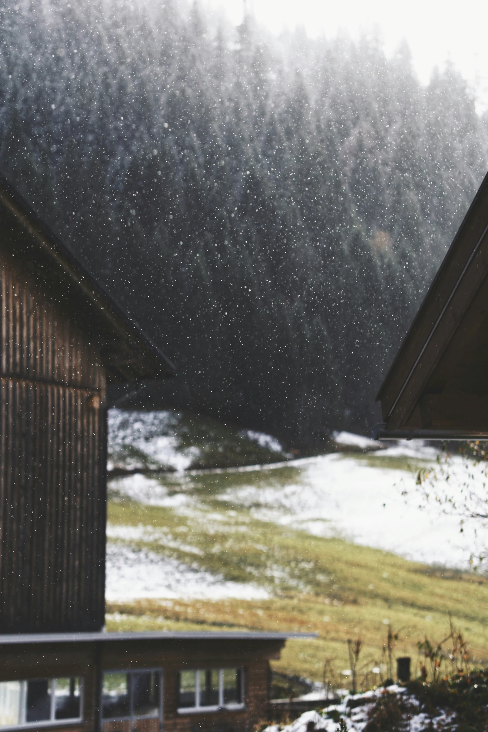 a building next to a large field covered in snow