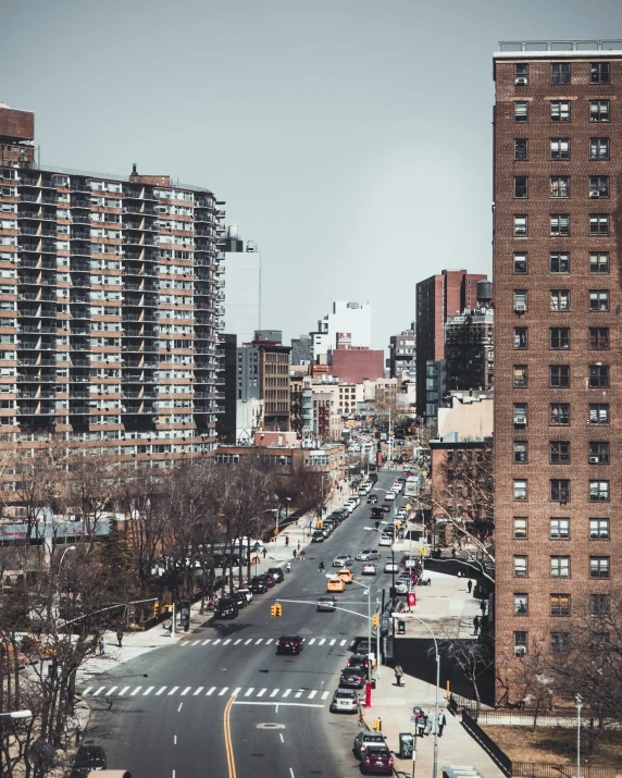 street in city with cars parked on both sides