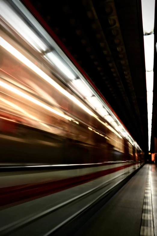 long exposure po of train passing under bridge