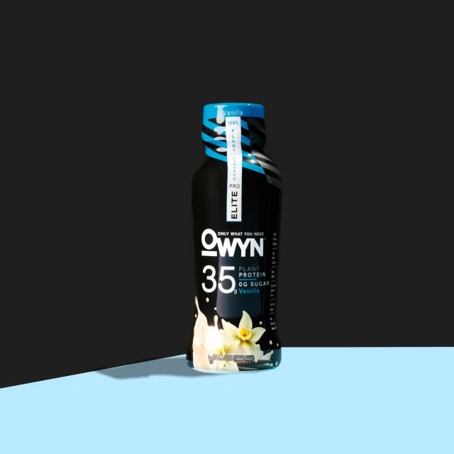 a bottle of whey chocolate on a blue and grey background
