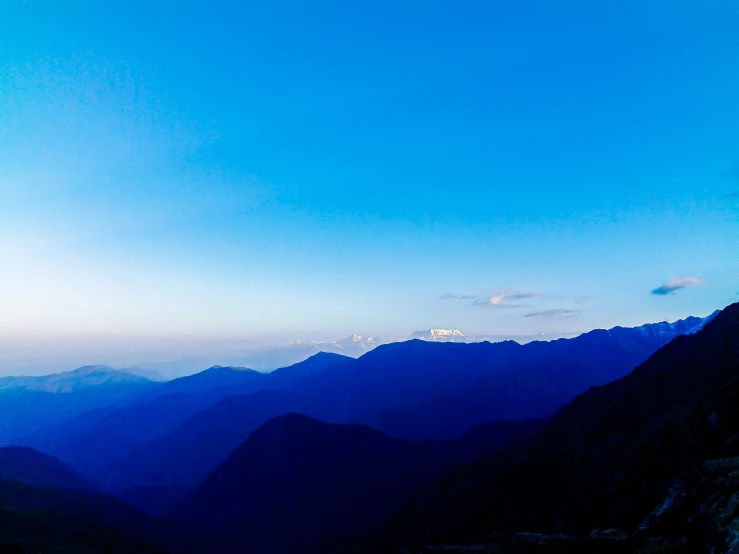 a beautiful view from a mountain looking down at some hills