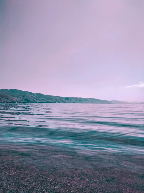 a view of a distant horizon over some water