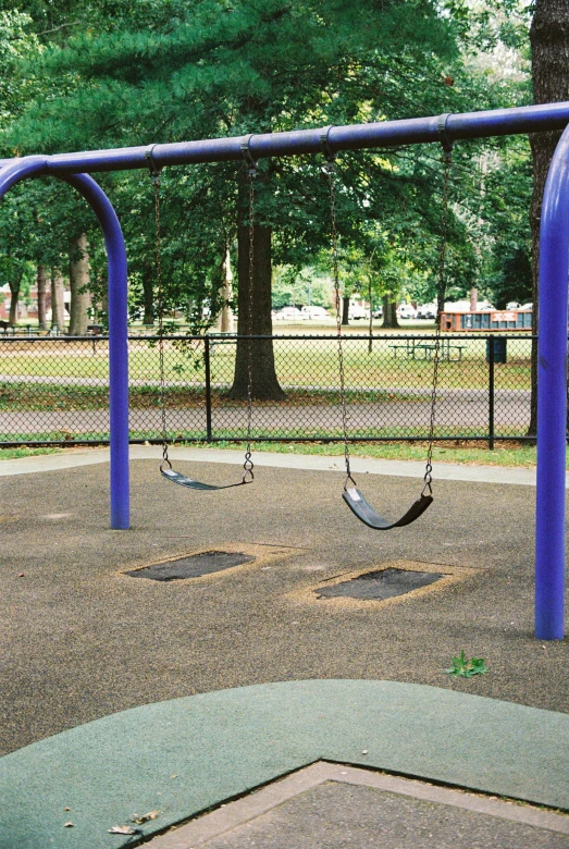 the swing is blue in this children's playground