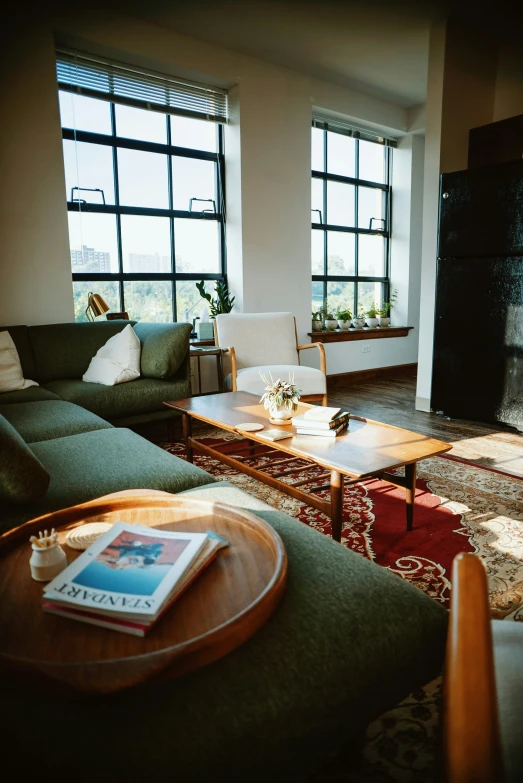 a couch, table, television, rug and fireplace in a living room