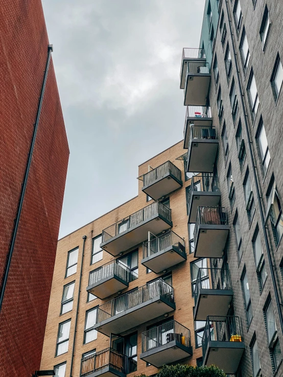 buildings in the city with balconies on each floor