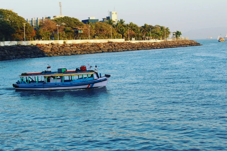 a boat on a river and trees around it