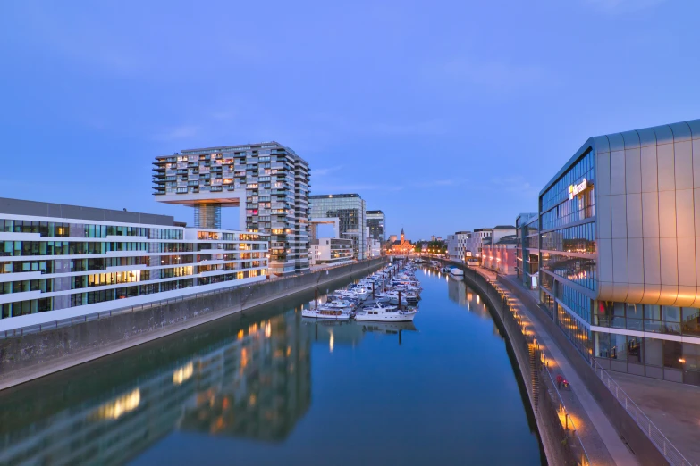 buildings and docks line the water in an illuminated area