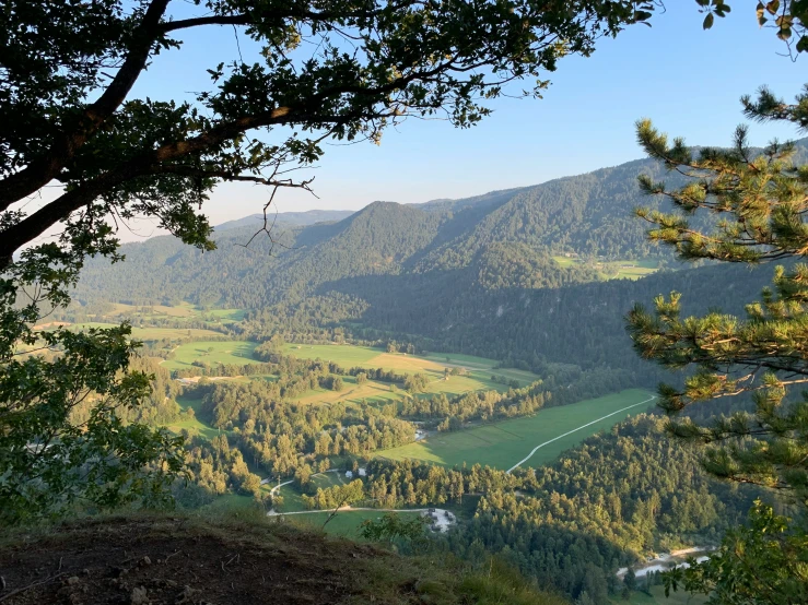 view over valley below to valley in forested area