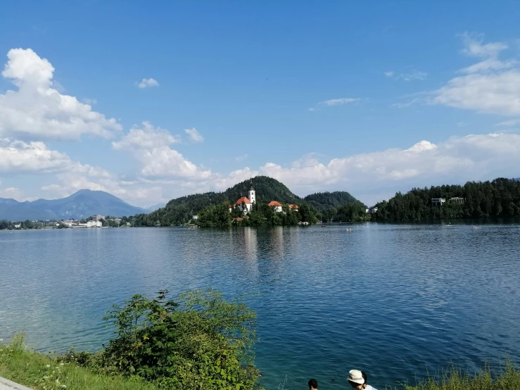 a man on a bench overlooking the water