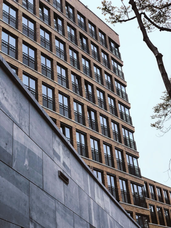 the facade of a building with balconies and bars