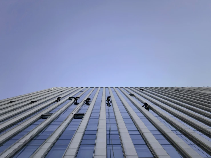 the front side of a building that has a blue sky in it