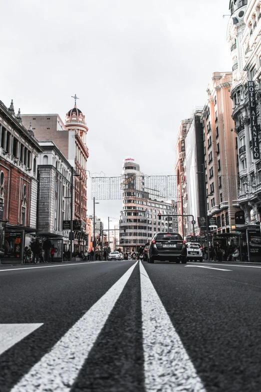 this is a black and white po of the street in a city