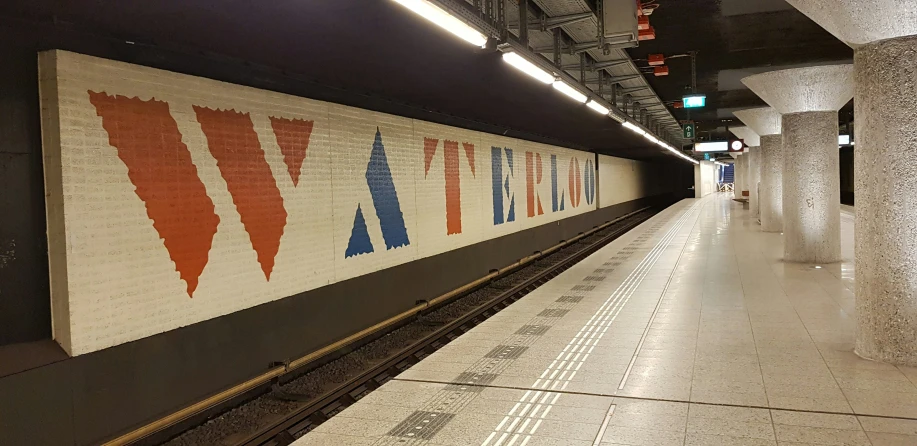 the train station is full of tracks and subway subway signs