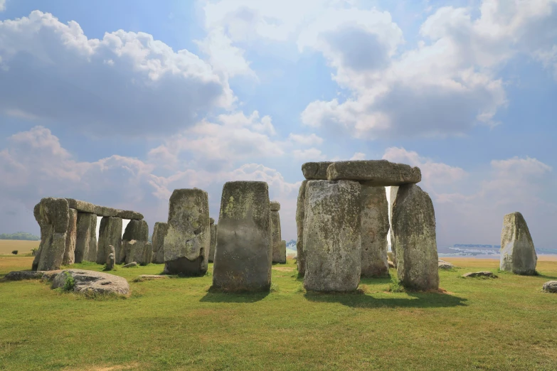 the stones of stonehenge can be seen in the grass