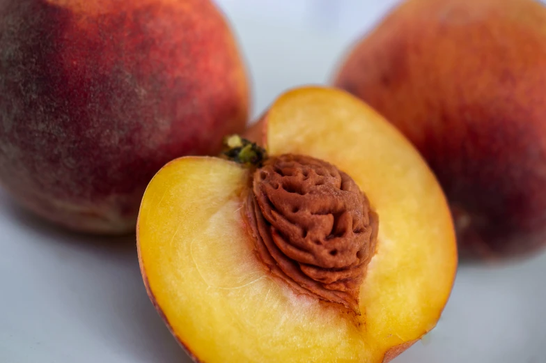 a couple of peaches on top of a table