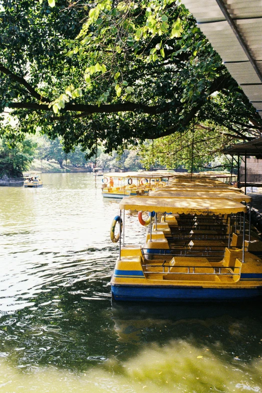 a boat filled with people floating down a river