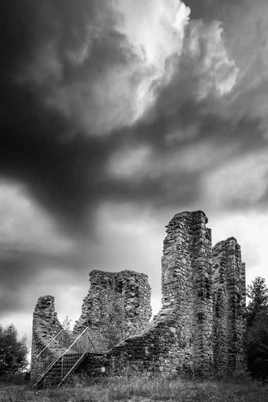 a castle with clouds in the background