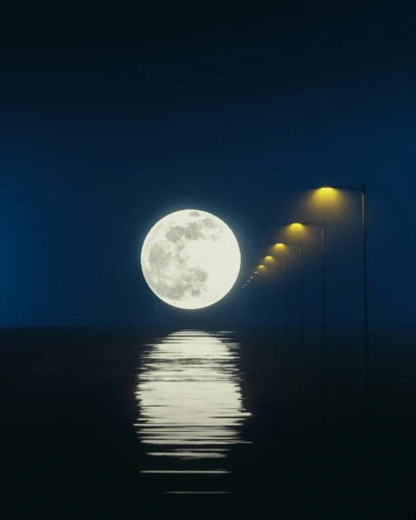 the moon shines brightly in the night sky above water