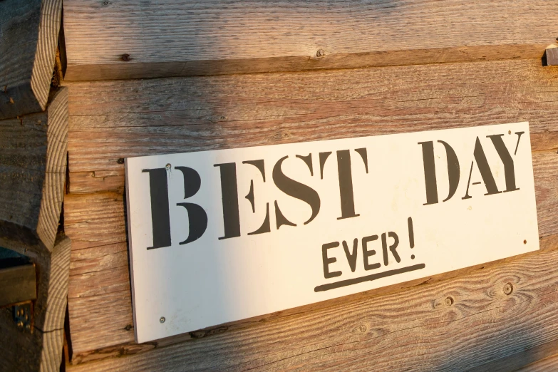 a sign on the side of a building saying best day ever