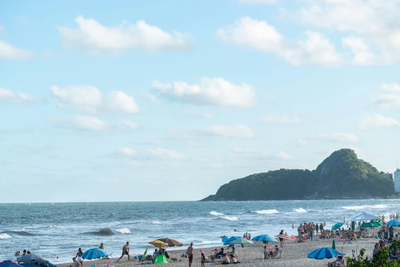 the beach has lots of people on it