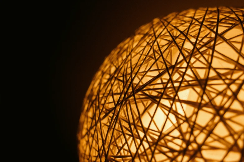 an orb shaped lamp with some lines on the inside